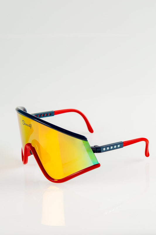 The Cornea Combusters | Red And Blue Revo Retro Macho Sunglasses - Shinesty