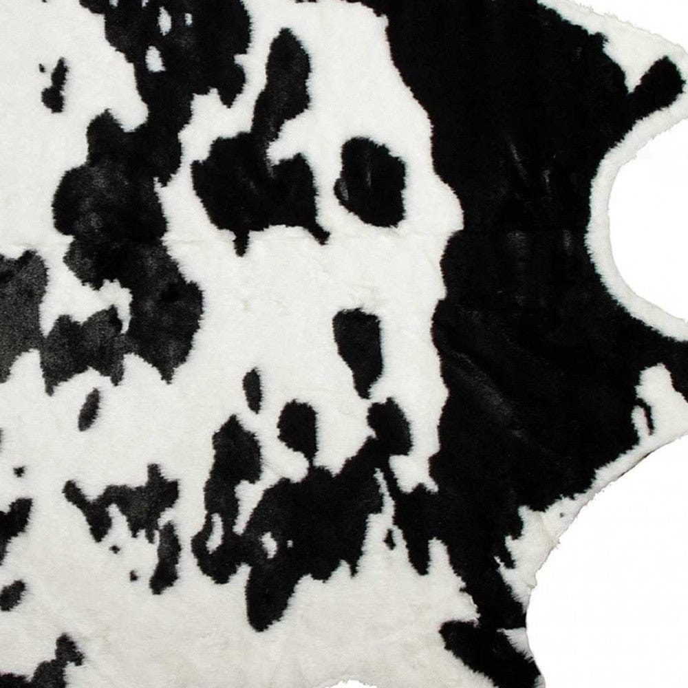 4' X 5' Black and White Faux Cowhide Animal Print Area Rug