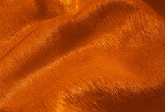 Alfombra de piel de vaca color naranja de 72" x 84"