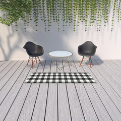 2' X 8' Black and Ivory Indoor Outdoor Area Rug