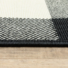 2' X 8' Black and Ivory Indoor Outdoor Area Rug