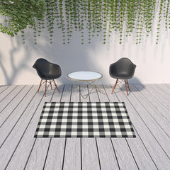 5' X 8' Black and Ivory Indoor Outdoor Area Rug - Homeroots