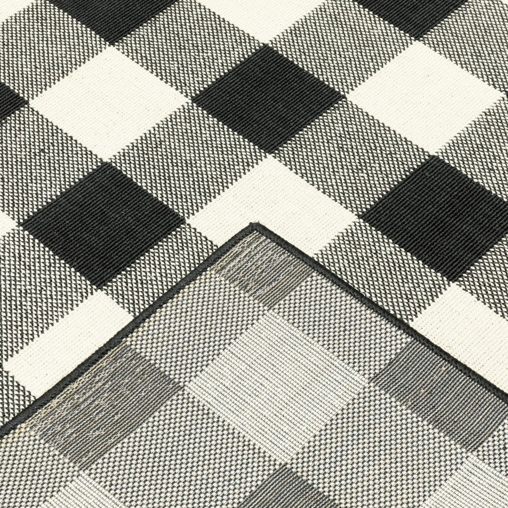 5' X 8' Black and Ivory Indoor Outdoor Area Rug - Homeroots