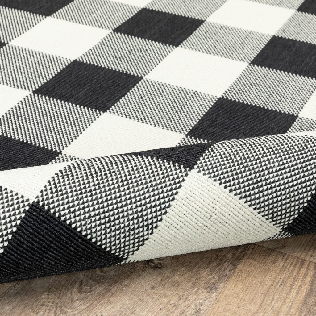 5' X 8' Black and Ivory Indoor Outdoor Area Rug - Homeroots