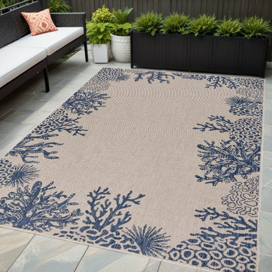 5' X 7' Beige and Blue Coral Stain Resistant Indoor Outdoor Area Rug