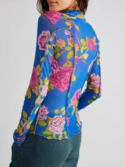 Blusa de manga larga con cuello alto y estampado floral