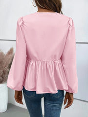 Blusa de manga larga con lazo y peplum de Ivy Lane