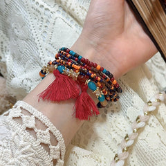 Pulsera de cuentas de arroz con borlas