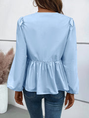 Blusa de manga larga con lazo y peplum de Ivy Lane