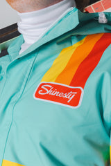 The Midday Aprés | Teal and Orange Retro Stripe One Piece Ski Suit