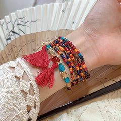 Pulsera de cuentas de arroz con borlas