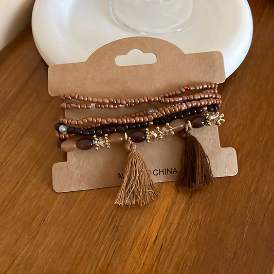 Pulsera de cuentas de arroz con borlas