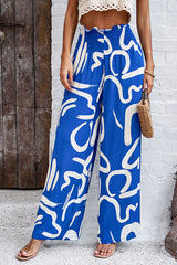 Smocked Printed Wide Leg Pants with Pockets - Flyclothing LLC