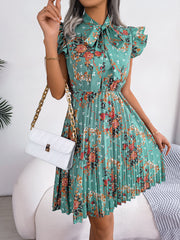 Pleated Floral Printed Tie Neck Knee Length Dress - Flyclothing LLC