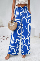 Smocked Printed Wide Leg Pants with Pockets - Flyclothing LLC