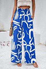 Smocked Printed Wide Leg Pants with Pockets - Flyclothing LLC